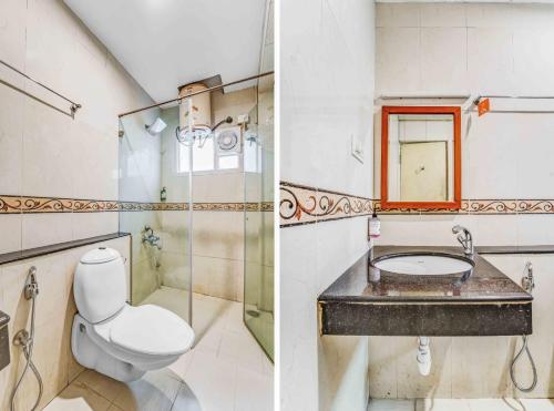 a bathroom with a toilet and a sink at Upar Hotels Cinecity Kodambakkam RAGHAVENDRA MANDAPAM in Chennai