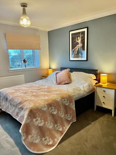 a bedroom with a large bed and a window at St Martin’s view in Haverfordwest