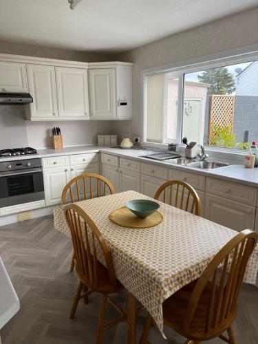 a kitchen with a table with a bowl on it at St Martin’s view in Haverfordwest