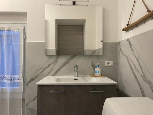 a bathroom with a sink and a toilet at Casa Dea 3 in Seriate