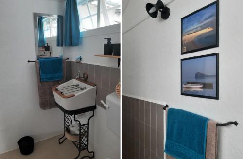 Calodyne的住宿－Kailani，浴室设有水槽和带蓝色毛巾的卫生间。