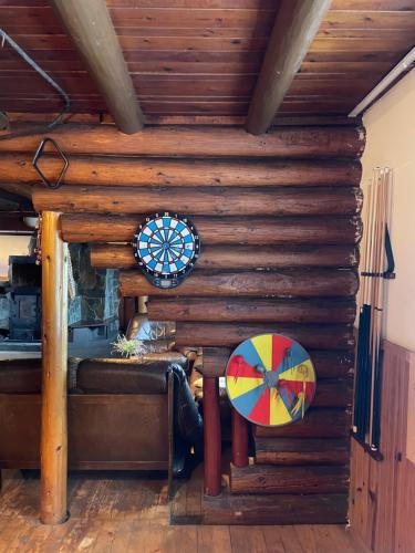 a room with a wooden wall with a window at Vrch Varta in Ružomberok