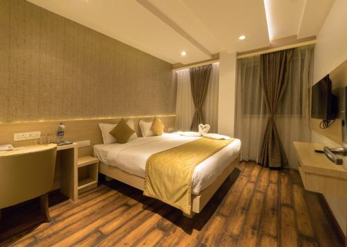 Tempat tidur dalam kamar di Hotel Samudra