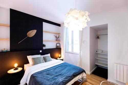 Posteľ alebo postele v izbe v ubytovaní Le Crêt - Place Jean Jaurès