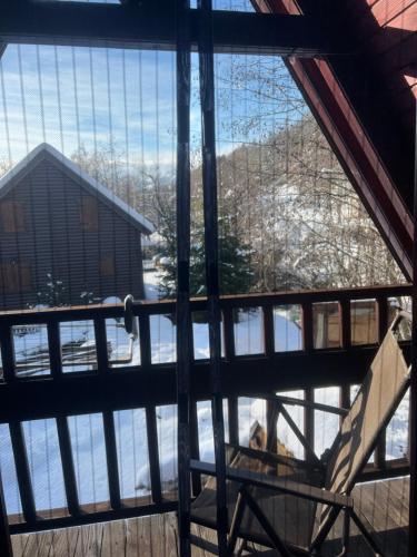 a view from a window of a house with snow at Vikendica Rajsko selo in Kolašin