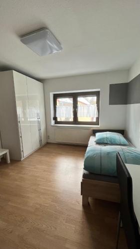 Postel nebo postele na pokoji v ubytování Monteurzimmer Ringingen