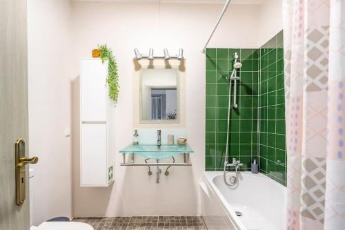 a bathroom with a tub and a sink and a shower at Blue House in Santa Cruz with Sea View in Santa Cruz