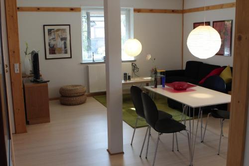 a living room with a table and chairs at Den Japanske Have B & B in Herning