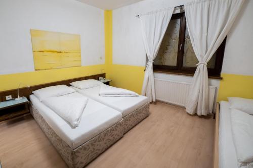 Postel nebo postele na pokoji v ubytování B&B Hotel Heimgartl