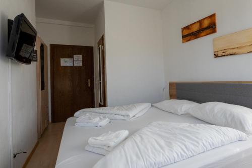 Postel nebo postele na pokoji v ubytování B&B Hotel Heimgartl
