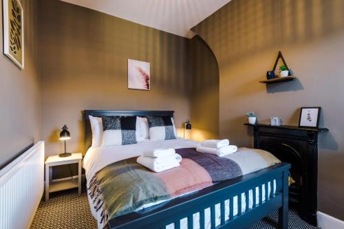 Säng eller sängar i ett rum på Cornwall House
