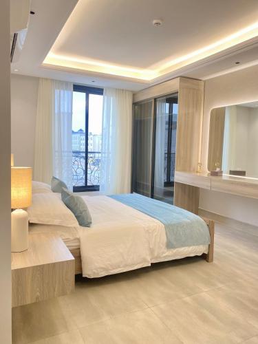 a bedroom with a large bed and a window at Spacious new 2 bedroom Apt-in amazing location B9 in Riyadh