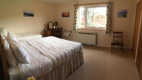 מיטה או מיטות בחדר ב-Cairn Shiel