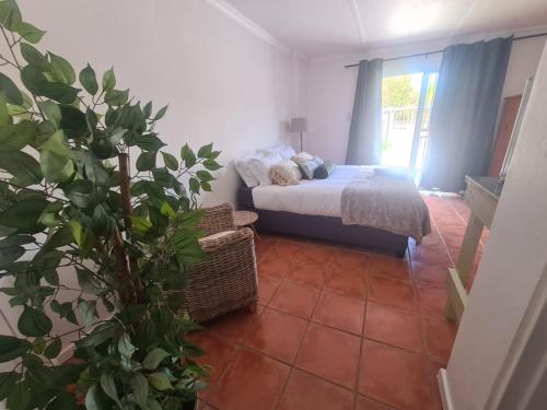 Ένα ή περισσότερα κρεβάτια σε δωμάτιο στο The Fellows Guest Accommodation