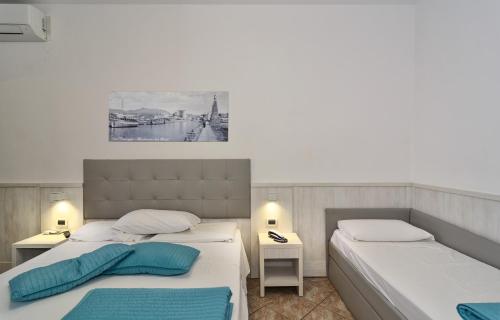 Ένα ή περισσότερα κρεβάτια σε δωμάτιο στο Hotel Bella Riviera Lungomare