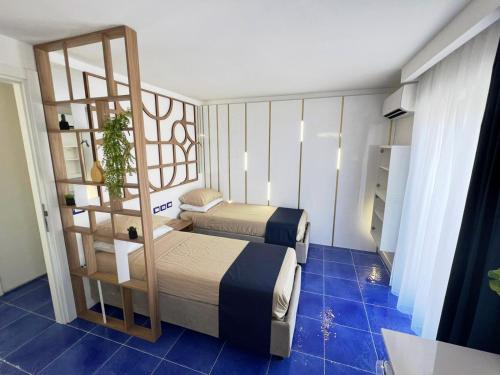Ένα ή περισσότερα κρεβάτια σε δωμάτιο στο Luxury in the heart of Tropea- Residenza AquaLaguna