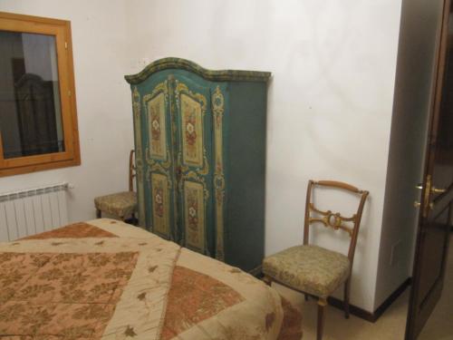 Una cama o camas en una habitación de Podere Riosto Cantina&Agriturismo