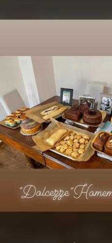 a table topped with different types of pastries and cakes at B & B L'ABBRACCIO in Agnone