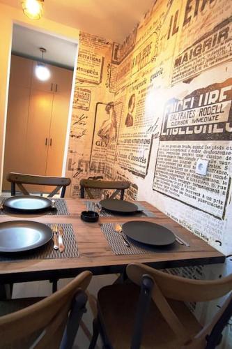 a wooden table with chairs in a restaurant at Blackwood Hill in Belgrade