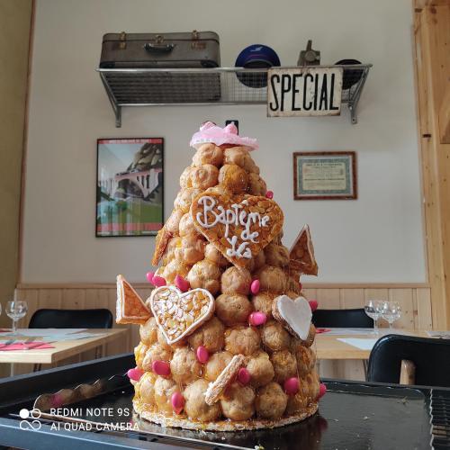 a christmas tree made out of cookies on a table at Transhumance & cie, Auberge, Appartements & SPA in Bedous