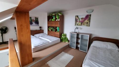 Postel nebo postele na pokoji v ubytování Apartmán G4 v Tatranskej Štrbe - Apartmánový dom Golem