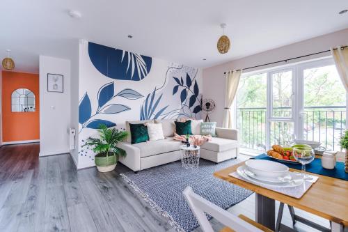 a living room with a couch and a table at Formby Village Apartments By Greenstay Serviced Accommodation - A Luxury 2 Bed Apt - Perfect for Couples, Friends, Families & Business Travellers - FREE Parking - Dog Friendly - Fast Wi-Fi - 6 in Formby