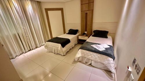 Postel nebo postele na pokoji v ubytování Hd Park Hotel