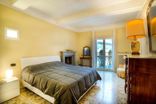 a bedroom with a bed and a fireplace at Dama charming apartment 100m from Piazza del Campo in Siena