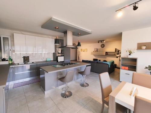 a large kitchen with a island in the middle at Large Central Apartment Near Valletta & Seafront in Pieta