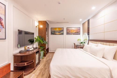 Ένα ή περισσότερα κρεβάτια σε δωμάτιο στο Reyna Luxury Hotel