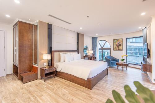 Ένα ή περισσότερα κρεβάτια σε δωμάτιο στο Reyna Luxury Hotel