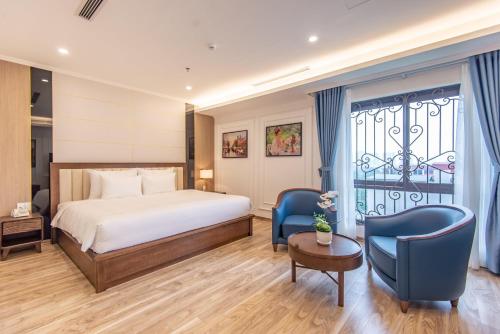 Ένα ή περισσότερα κρεβάτια σε δωμάτιο στο Reyna Luxury Hotel