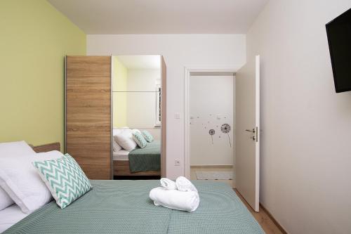 Ένα ή περισσότερα κρεβάτια σε δωμάτιο στο Apartment J&E