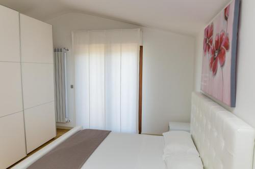 Letto o letti in una camera di Residenza Borgo degli Ulivi
