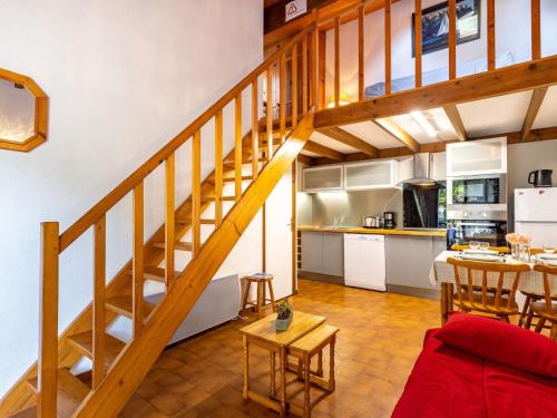 a kitchen and a living room with a staircase at Holiday Home Les Maisons de l'Océan-1 by Interhome in Les Mathes