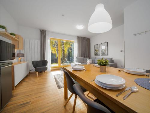 a kitchen and dining room with a table and chairs at Apartment Ski-In Ski-Out Mountain Duplex Portášky3 by Interhome in Pec pod Sněžkou