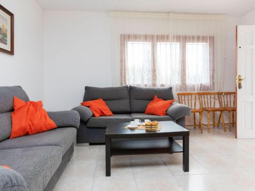a living room with a couch and a coffee table at Villa Villa Tello by Interhome in L'Ametlla de Mar