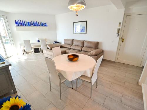 a living room with a table and a couch at Apartment Formentor by Interhome in Salou