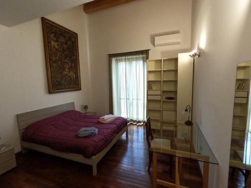 Postel nebo postele na pokoji v ubytování Suite Franziska LIFT & AC a Ballarò