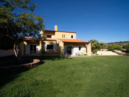 a house with a green lawn in front of it at Villa Mariana by Interhome in Galé