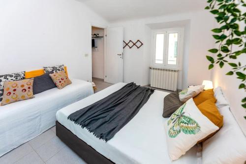 Ένα ή περισσότερα κρεβάτια σε δωμάτιο στο Nido al Mare - 20 metri dal mare (009029-LT-0767)