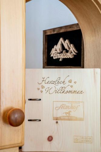 a refrigerator with a sign on the side of it at Almhof-Reithof Pitztal in Sankt Leonhard im Pitztal