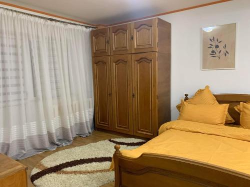Ένα ή περισσότερα κρεβάτια σε δωμάτιο στο Apartament Vaslui