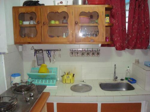 a kitchen with a sink and a counter top at Souriam Villa in Grand-Baie