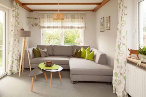 a living room with a couch and a table at Chalet Manhard in Pfronten
