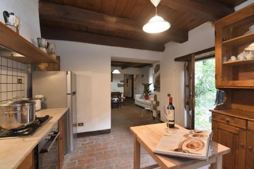 a kitchen with a table with a plate of food on it at Il Vecchio Mulino in Coreglia Antelminelli