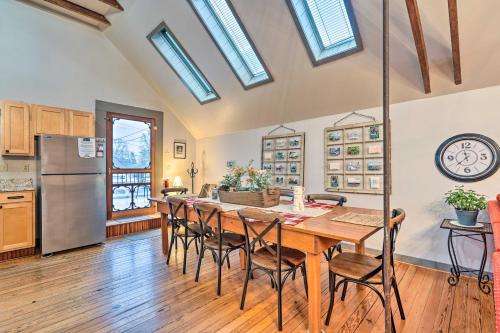 a kitchen and dining room with a table and chairs at Pet-Friendly Loft Vacation Rental with Fire Pit! in Bemus Point