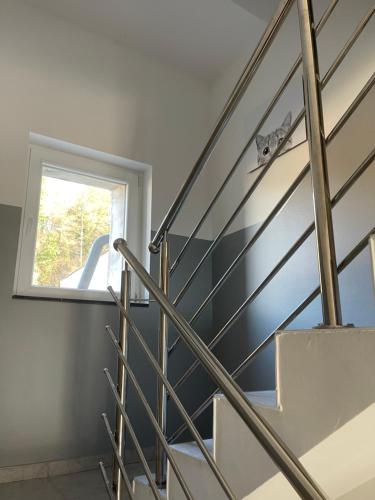 a staircase in a house with a window at Apartmani "Stari Grad - Samobor" in Samobor