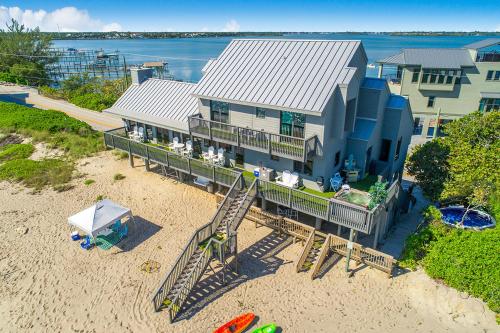 an aerial view of a house with a playground at Restoration Sands in Stuart
