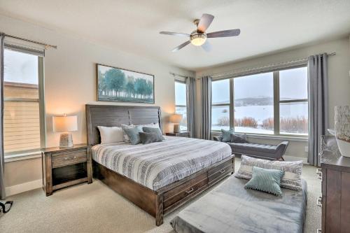 a bedroom with a bed and a ceiling fan at Mountain-View Granby Retreat on Golf Course! in Granby